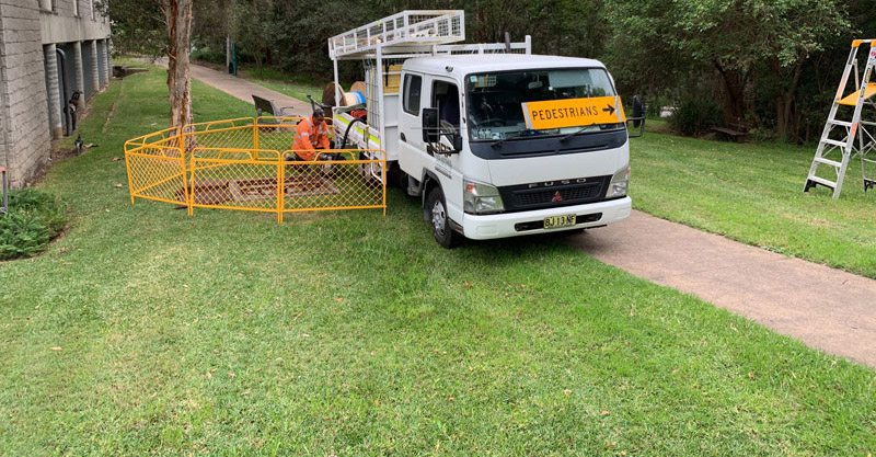 work truck and pedestrian sign